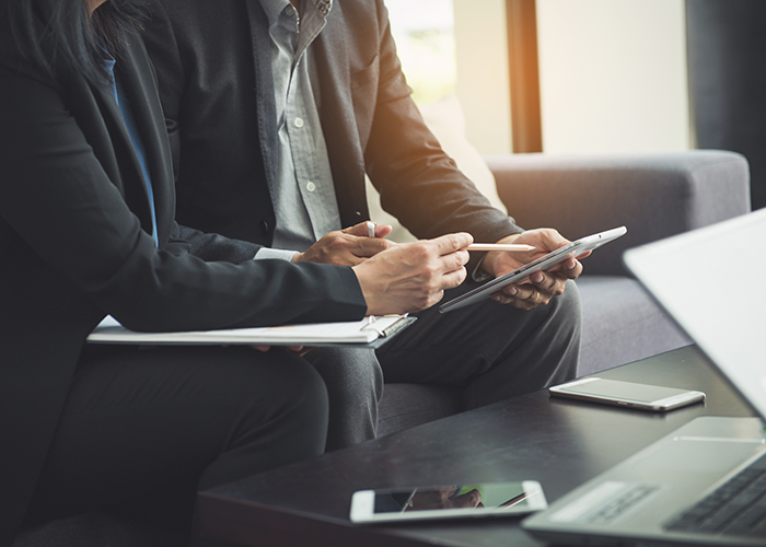 Team work process. young business managers crew working with new startup project. labtop on wood table, typing keyboard, texting message, analyze graph plans.